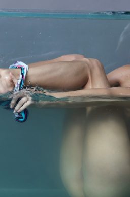 Wet teen babe Nancy A strips bikini bottom while posing in water